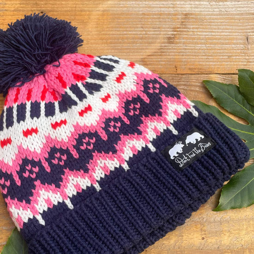 pink and blue pom pom hat