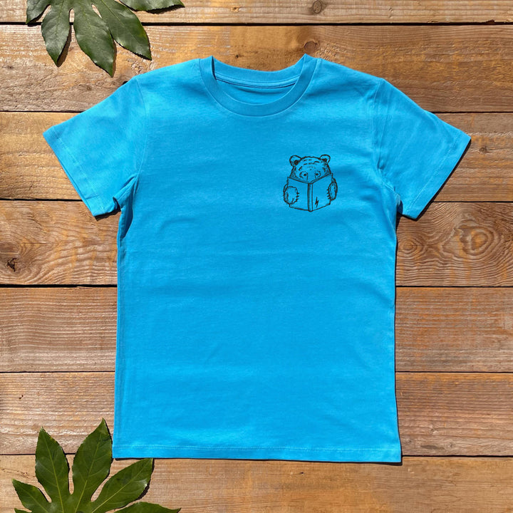 blue kids tee with bear reading a book