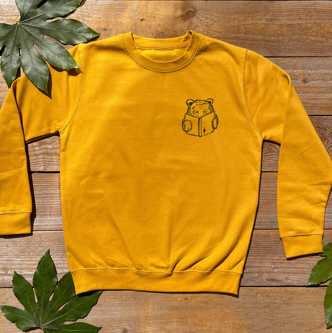 mustard colour jumper with bear reading a book