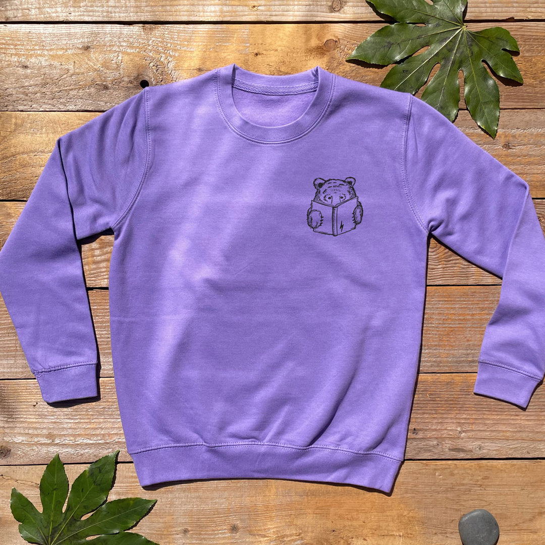 purple jumper with book bear design
