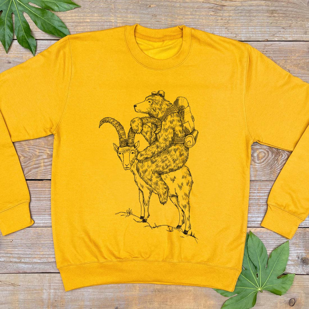 mustard sweater with bear a goat design