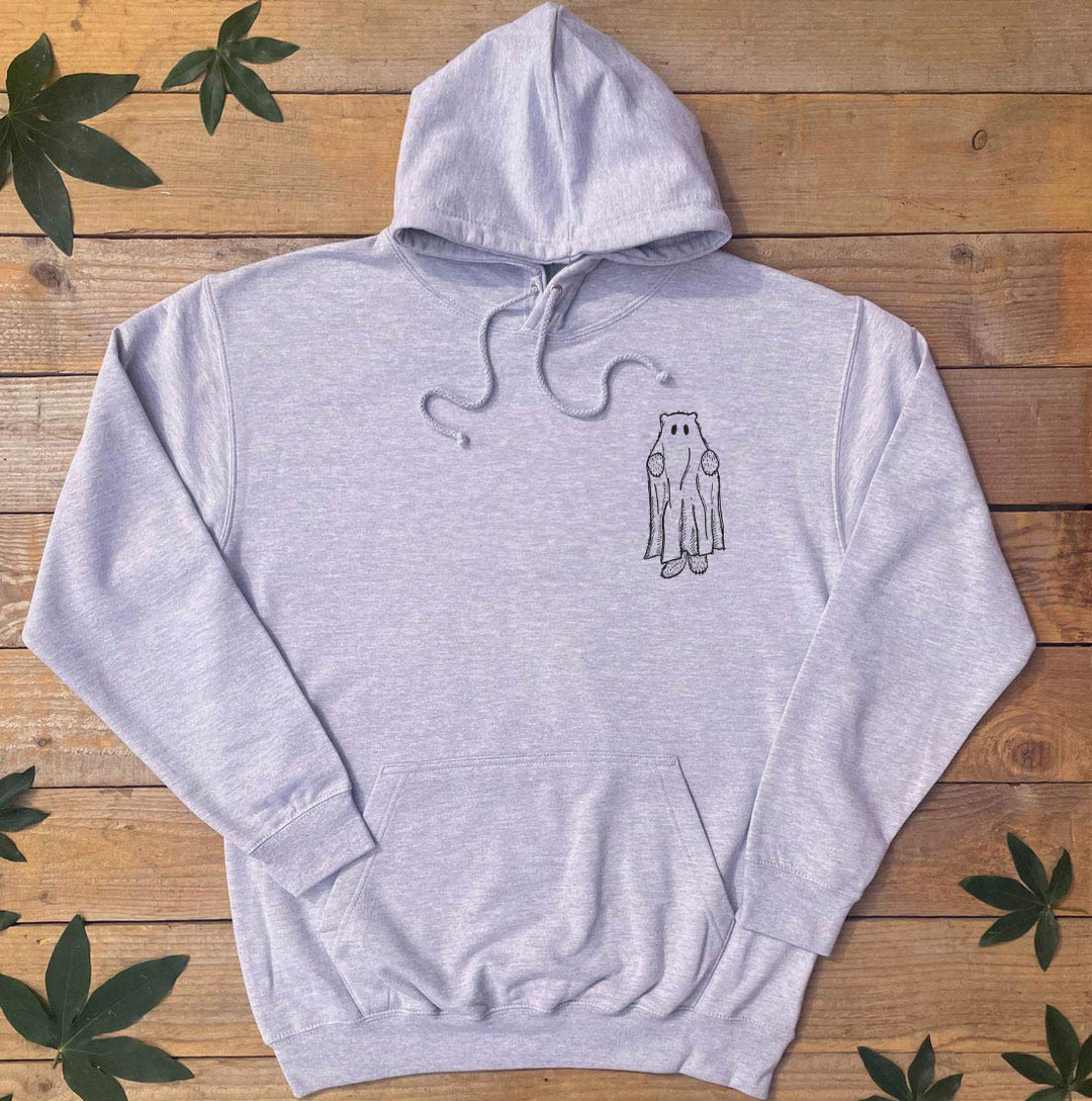 Gray hoodie with a small graphic on a wooden surface