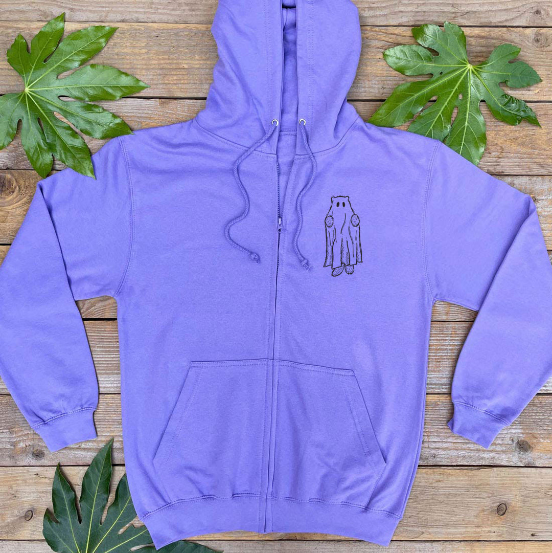 Purple hoodie with a small graphic on a wooden surface with leaves