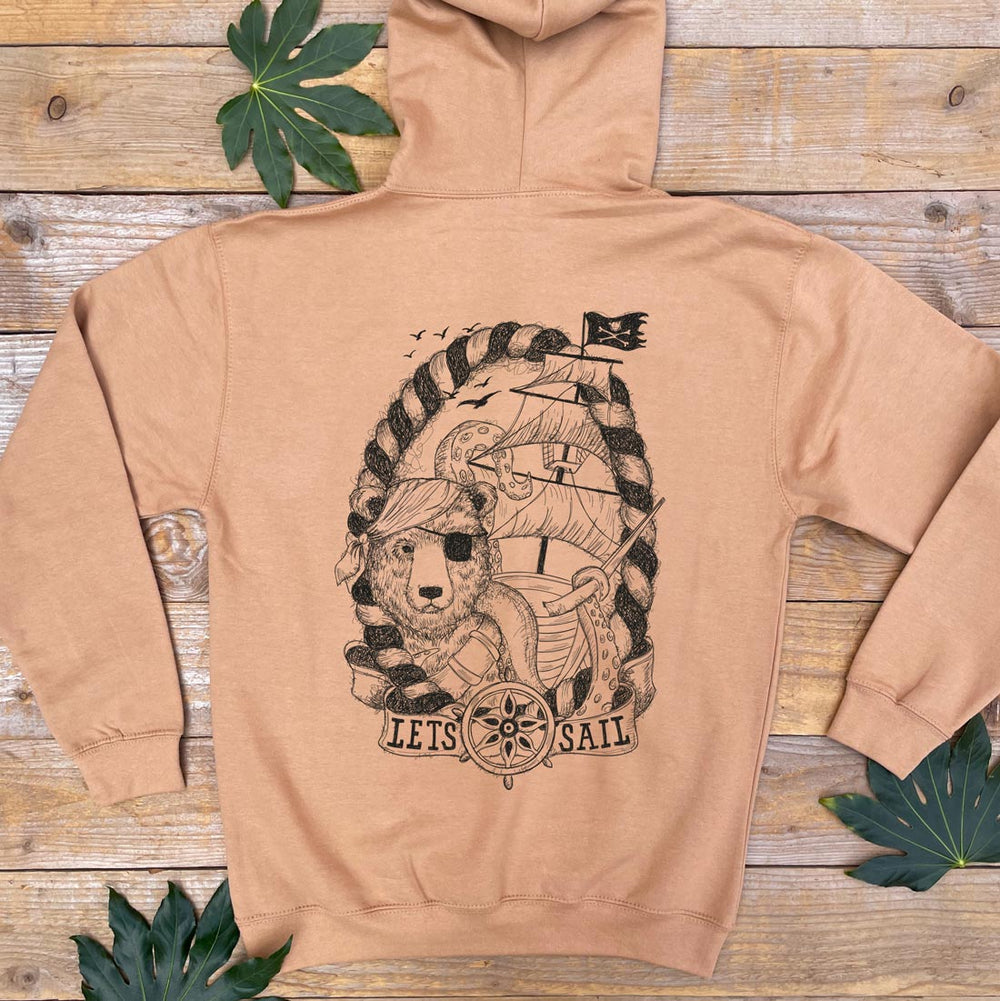brown hoodie with print of ship wreck and pirate bear
