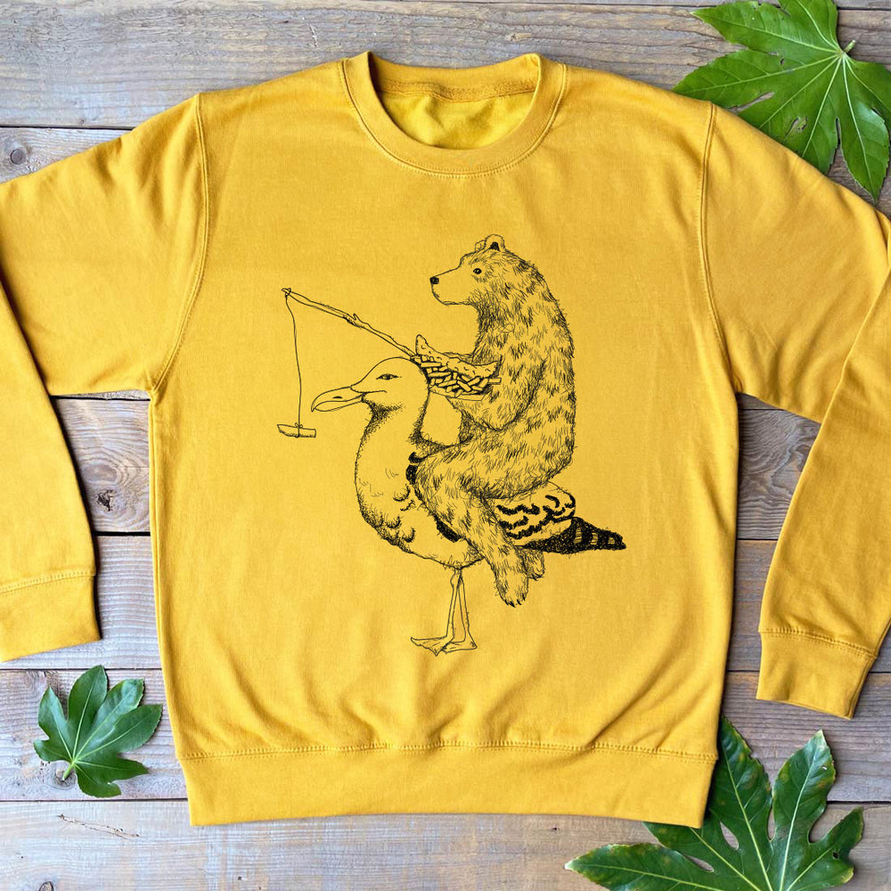 mustard colour jumper with bear riding a seagull design