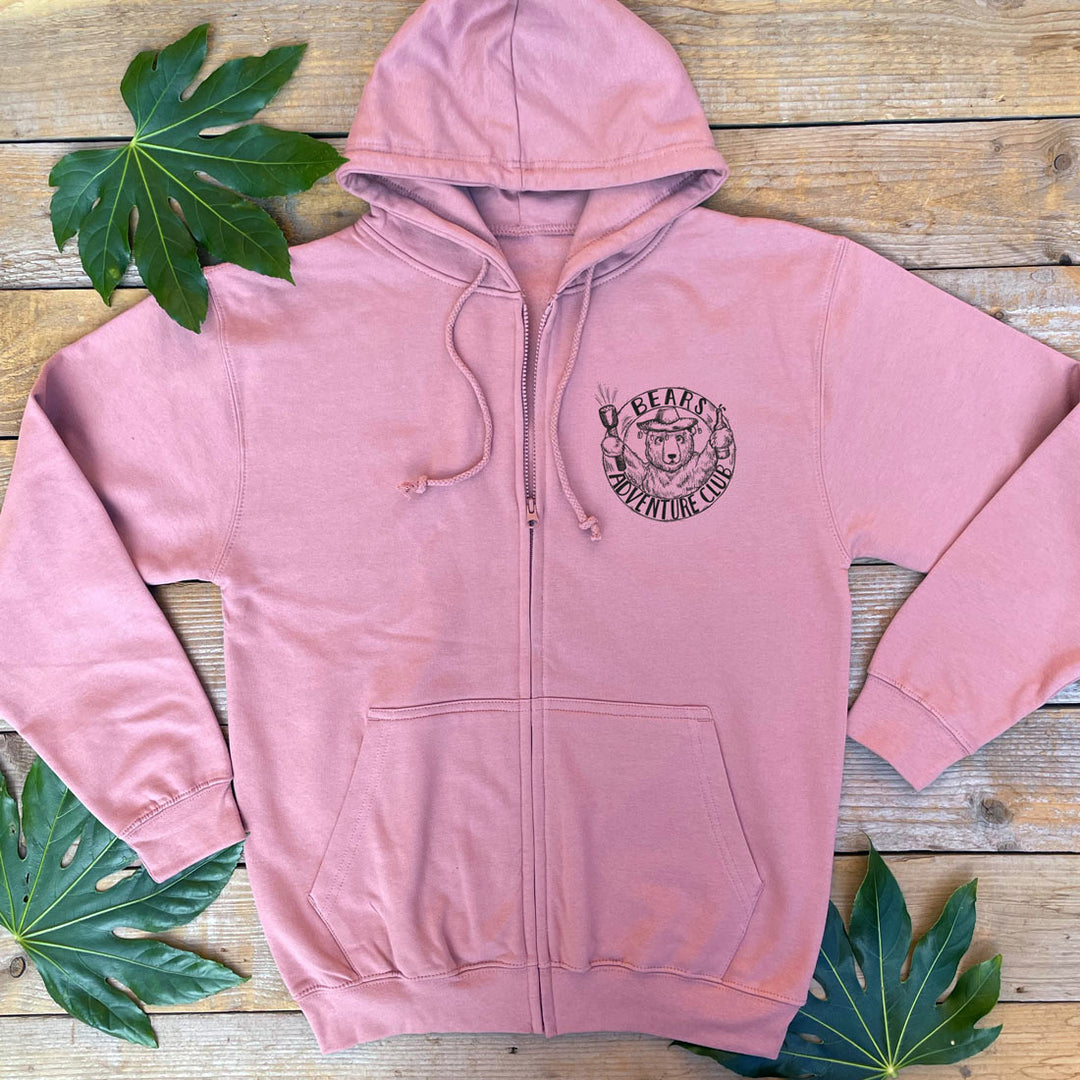 a dusy pink hoodie with a pocket print of bear adventure club
