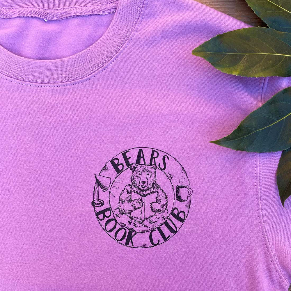 lavender jumper with bear and book logo