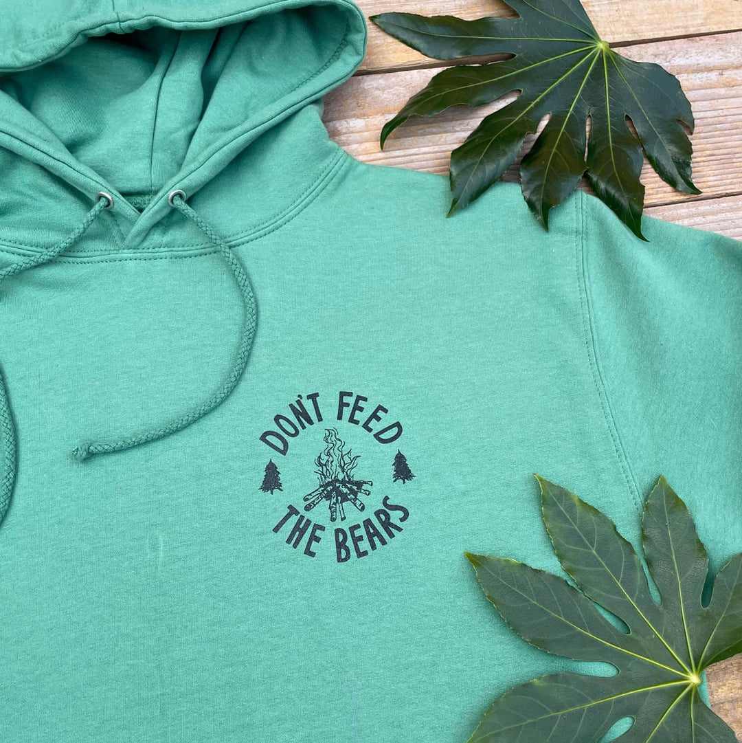 green hoodie and campfire logo