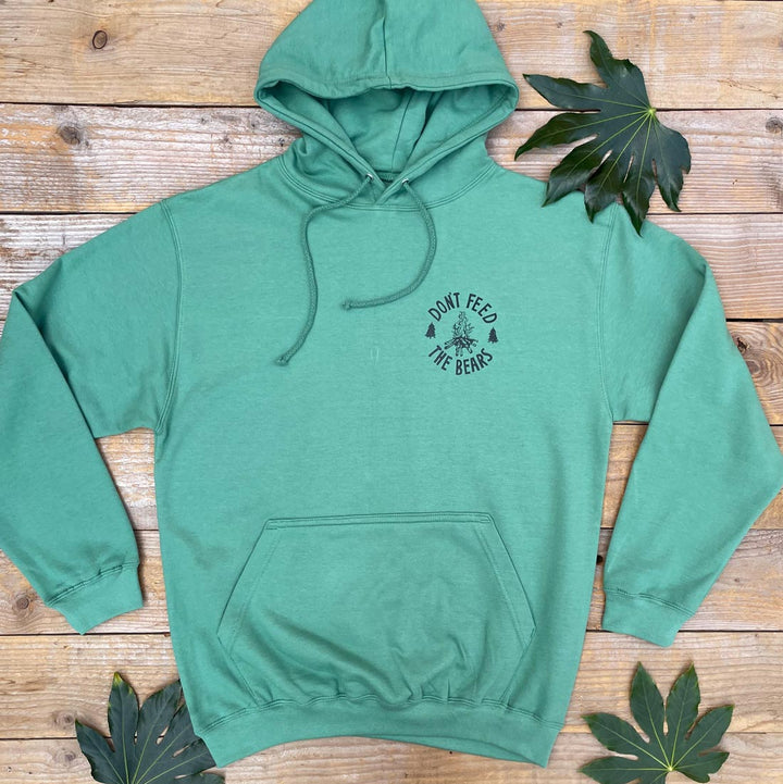 green hoodie with campfire print