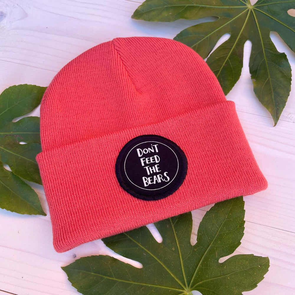 coral beanie don't feed the bears text hat