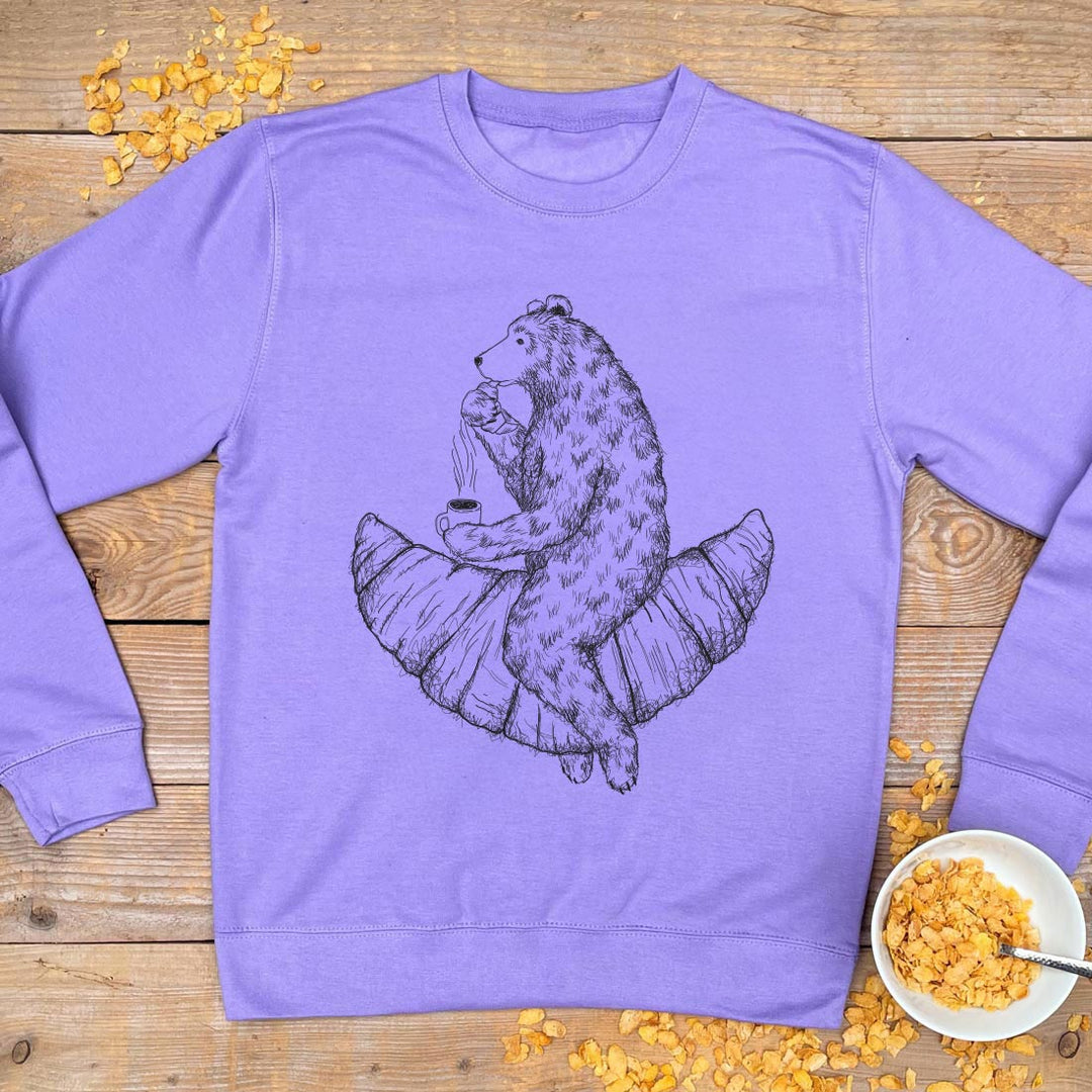 purple jumper with bear eating croissant print