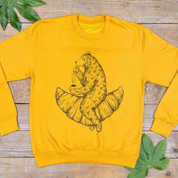 yellow jumper with bear riding a croissant design