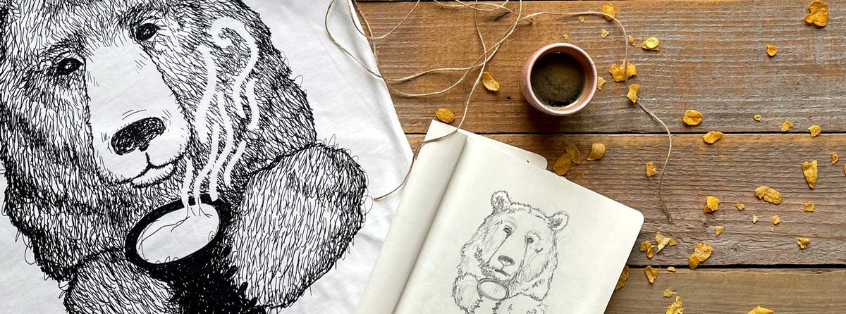 Lucy’s Cuppa Bear sketchbook alongside the finished screen-printed T-shirt