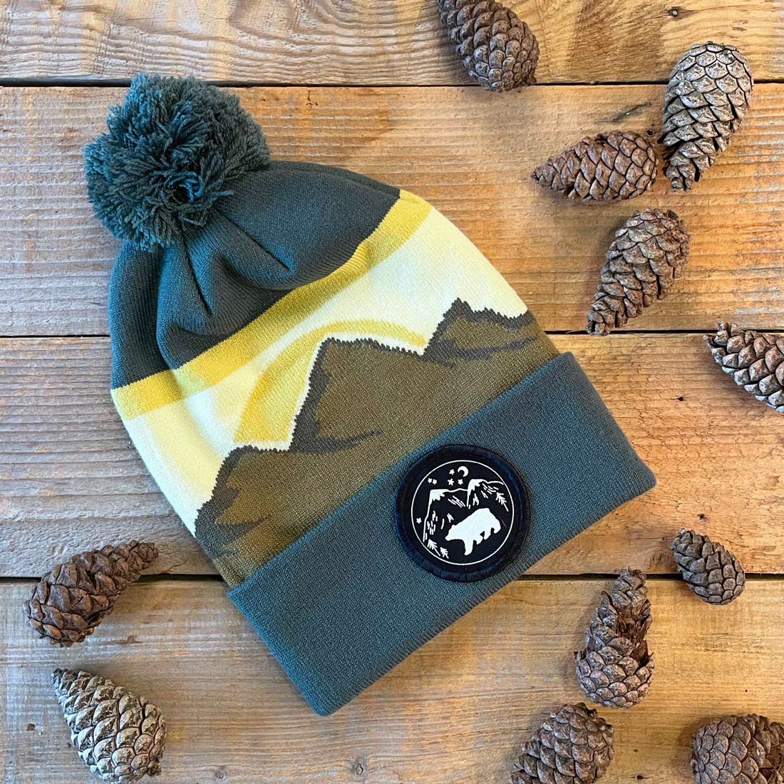 green bobble hat with mountains