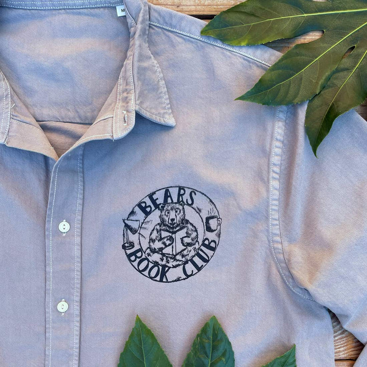 grey shirt with design on bears book club on the pocket