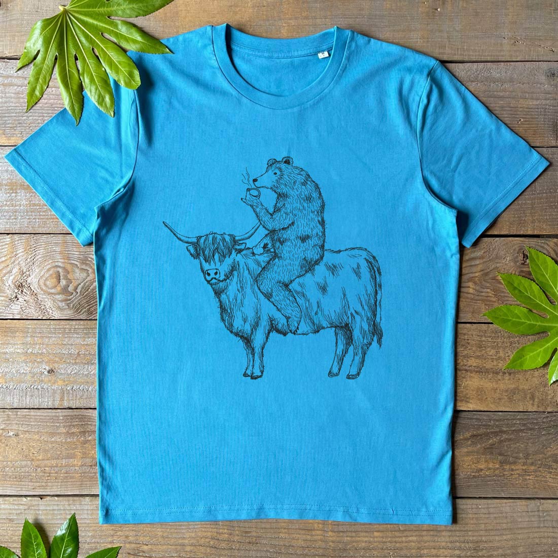 BEAR RIDING HIGHLAND COW BLUE TEE