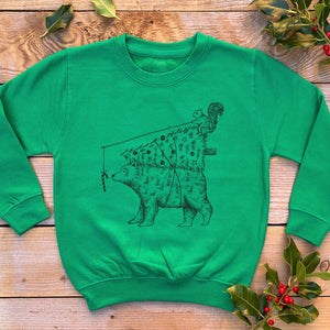 green kids jumper with bear carrying xmas tree