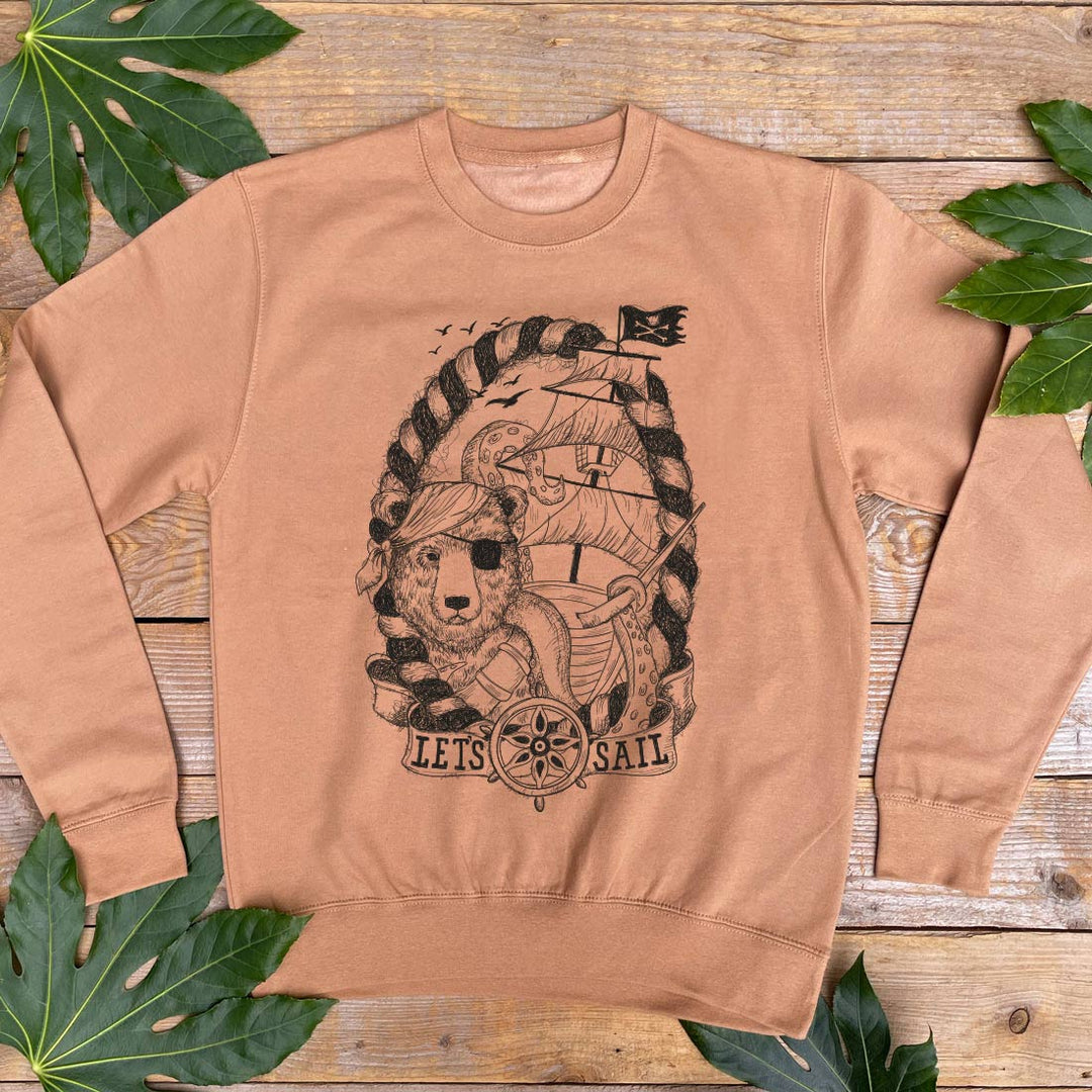 brown jumper with pirate bear design