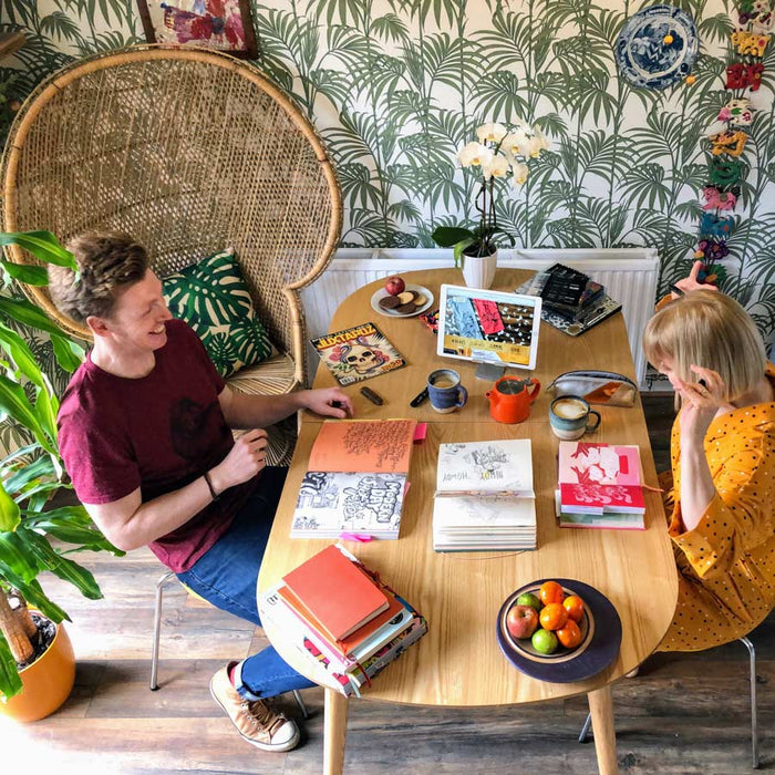 Lucy and Tom at their work table