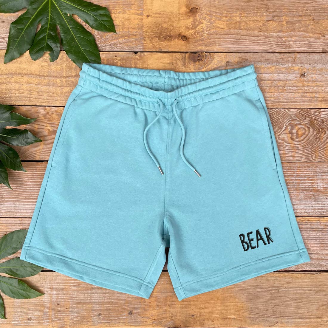 mint shorts with bear text