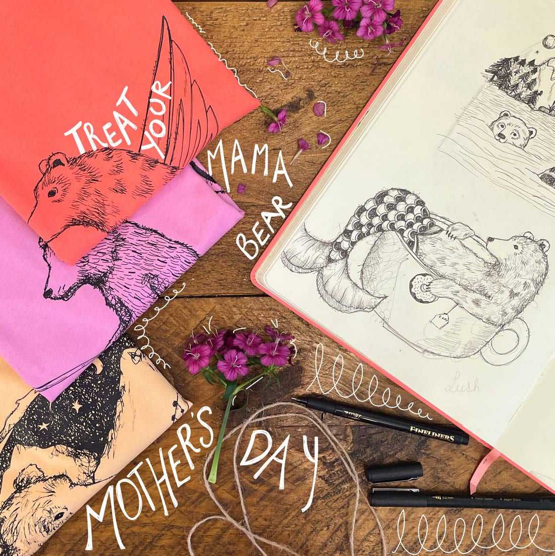 Mother's Day themed stationery items on a wooden surface with flowers.