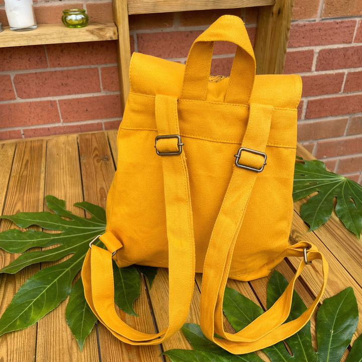 straps of mustard cotton backpack