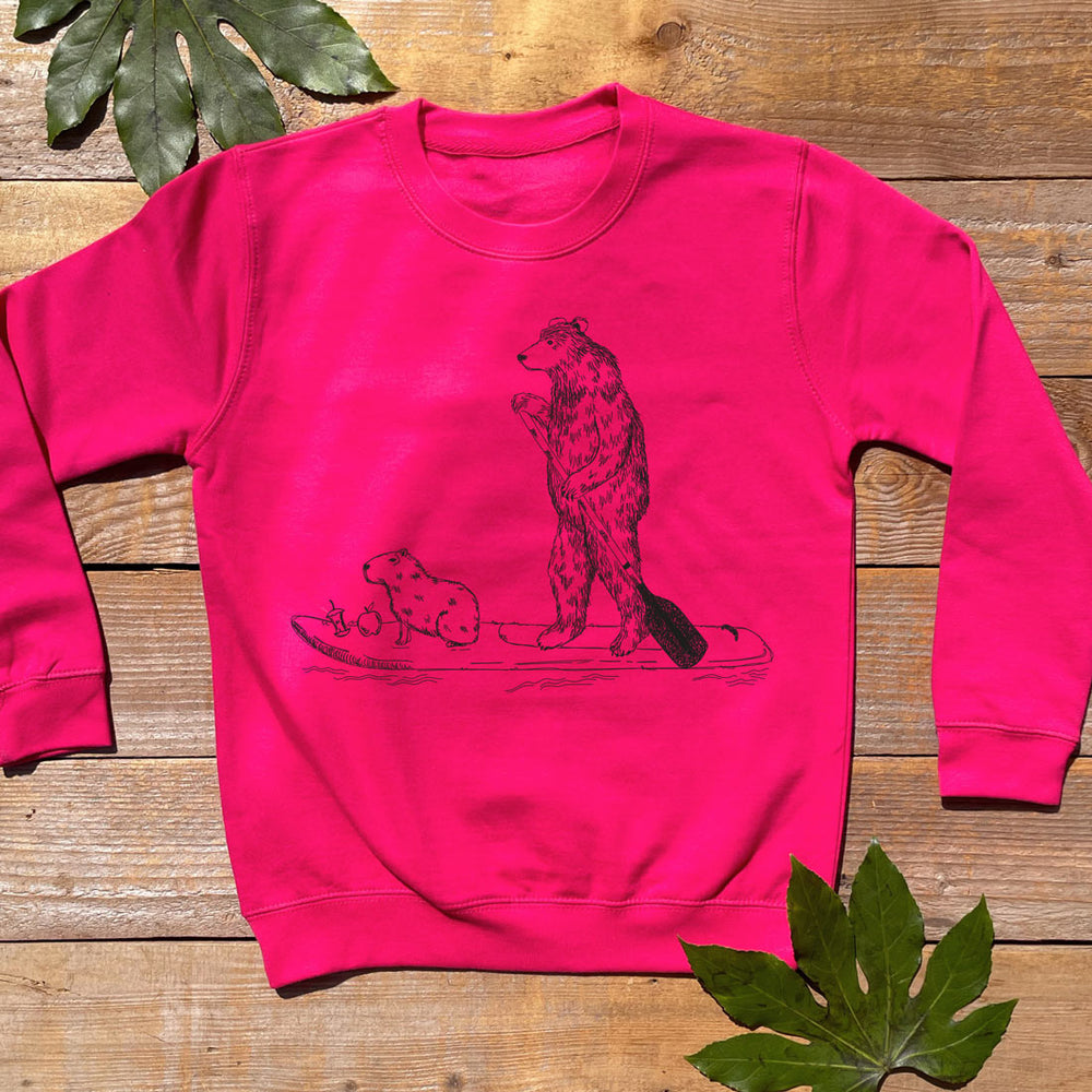 pink jumper with bear, capybara and paddle board design