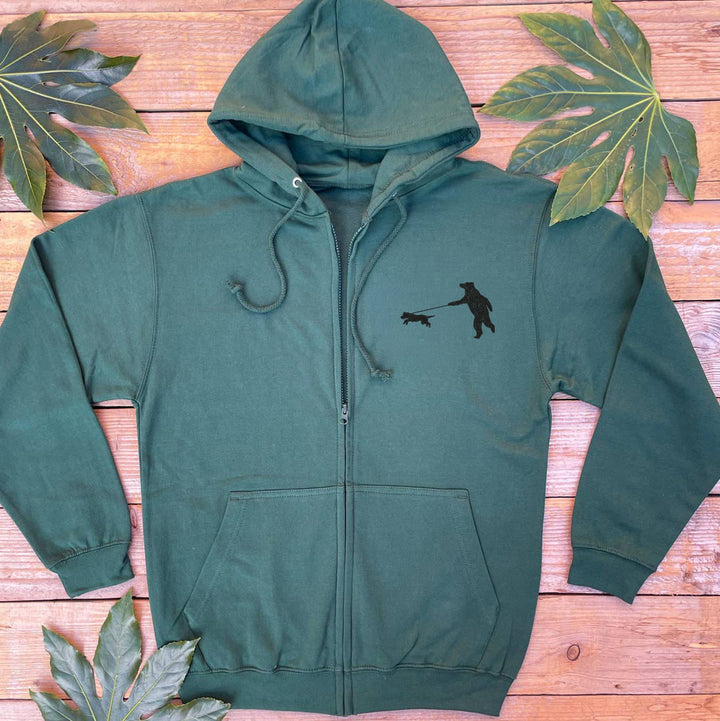 dark forest green hoodie with a bear and dog on a lead print
