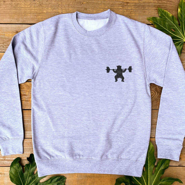 grey jumper with weight lifting bear